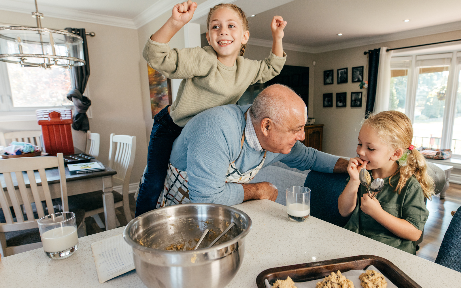 Older foster parent with two young children